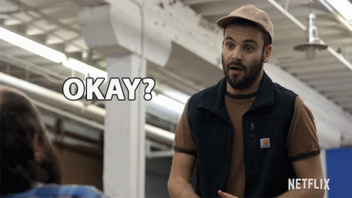 Man In Hat And Vest Saying Okay Netflix Ad GIF