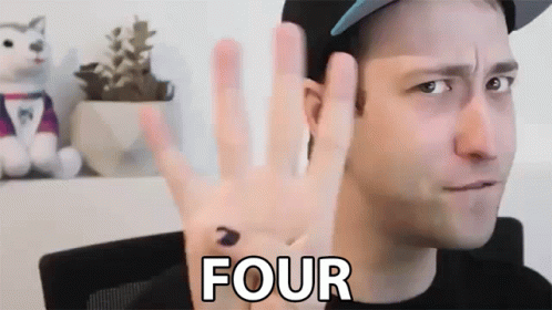 A Man Wearing A Hat Is Giving The Number Four With His Hand GIF