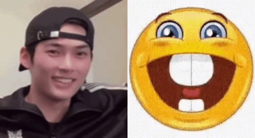 A Man Wearing A Hat Is Next To A Smiley Face GIF