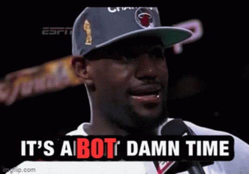 A Man Wearing A Hat Is Talking Into A Microphone And The Words It 'S A Bot Damn Time Are Above Him GIF