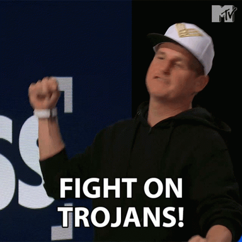 A Man Wearing A Hat Says Fight On Trojans GIF