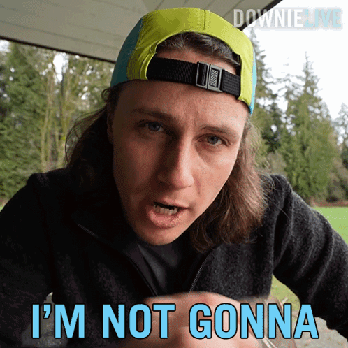 A Man Wearing A Hat Says " I 'M Not Gonna " In Blue GIF