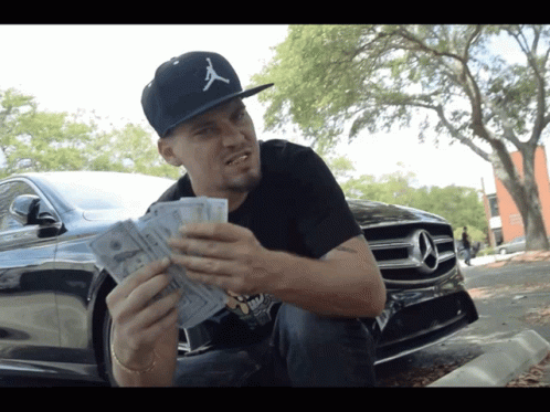 A Man Wearing A Hat That Says ' A ' On It GIF