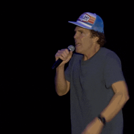 a man wearing a hat that says all day is holding a microphone and says how do you feel