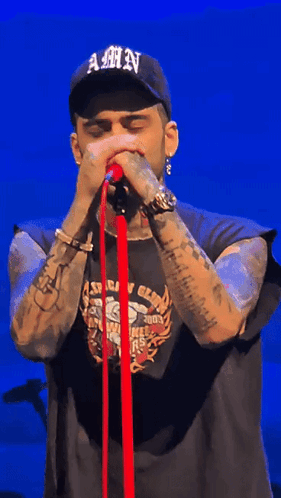 A Man Wearing A Hat That Says Amn On It GIF