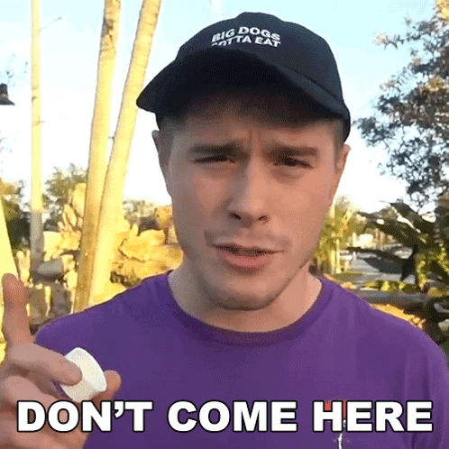 A Man Wearing A Hat That Says Big Dogs Only Eat Holds A Marshmallow And Says " Don 'T Come Here " GIF