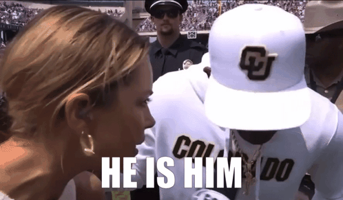 A Man Wearing A Hat That Says Colorado Is Talking To A Woman GIF