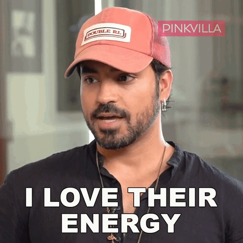 A Man Wearing A Hat That Says Double R.l. On It GIF