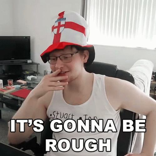 A Man Wearing A Hat That Says England Covering His Nose GIF