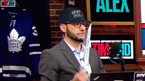 A Man Wearing A Hat That Says Grand Pol GIF