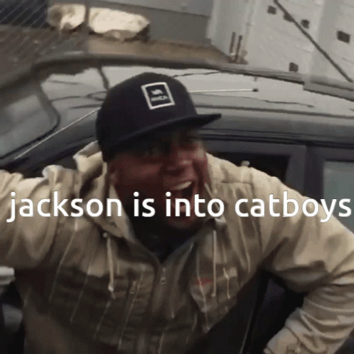 A Man Wearing A Hat That Says Jackson Is Into Cat Boys GIF