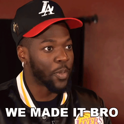 A Man Wearing A Hat That Says La On It GIF