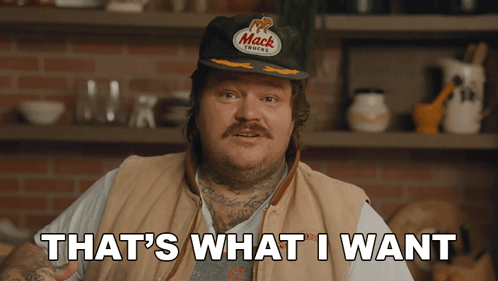 A Man Wearing A Hat That Says Mack Trucks On It GIF