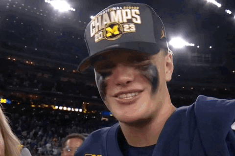 A Man Wearing A Hat That Says National Champions On It GIF