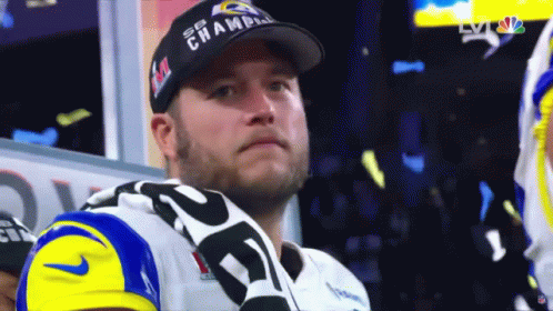 a man wearing a hat that says ' sb champ ' on it