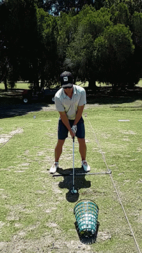 A Man Wearing A Hat That Says ' Scottsdale ' On It Is Holding A Golf Club GIF