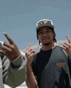 A Man Wearing A Hat That Says Tds Is Giving The Middle Finger GIF