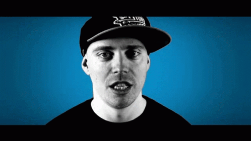 A Man Wearing A Hat That Says ' Xtreme ' On It Looks At The Camera GIF