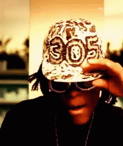 A Man Wearing A Hat With 305 On It GIF