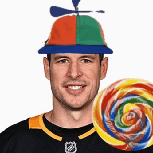 A Man Wearing A Hat With A Propeller And A Lollipop In Front Of Him GIF