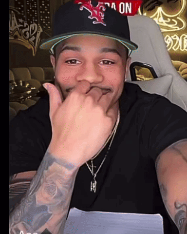 A Man Wearing A Hat With A Star On It GIF
