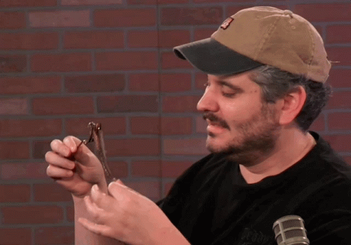 A Man Wearing A Hat With The Letter A On It GIF