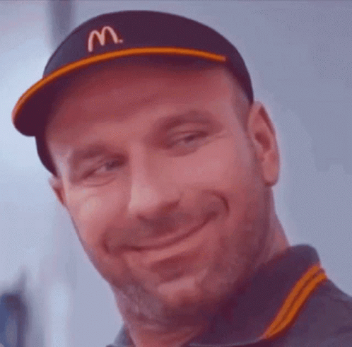 A Man Wearing A Hat With The Letter M On It GIF