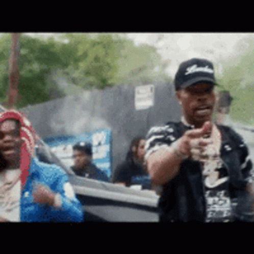 A Man Wearing A Hat With The Word Yankees On It Is Pointing GIF