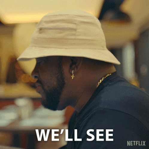 A Man Wearing A Hat With The Words We 'Ll See On It GIF