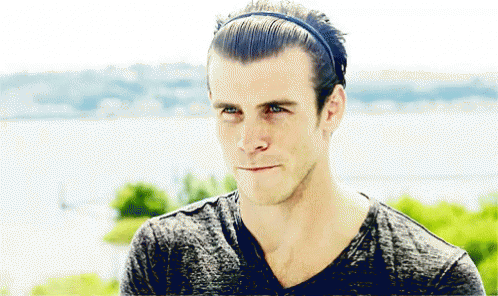 A Man Wearing A Headband And A Gray Shirt GIF