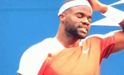 A Man Wearing A Headband And A Nike Shirt Is Smiling With His Eyes Closed GIF