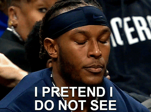 A Man Wearing A Headband And A Shirt That Says " I Pretend I Do Not See " GIF