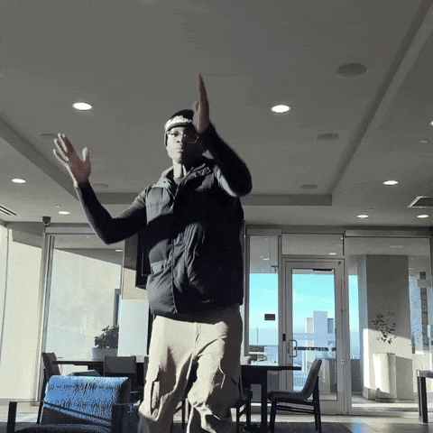 a man wearing a headband that says supreme is dancing
