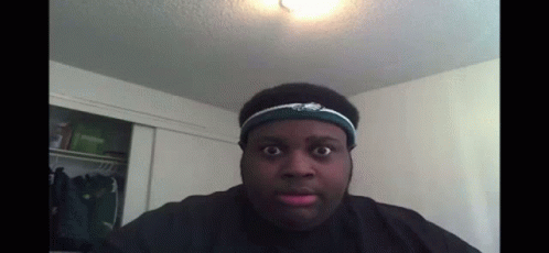 A Man Wearing A Headband With Eagles On It GIF