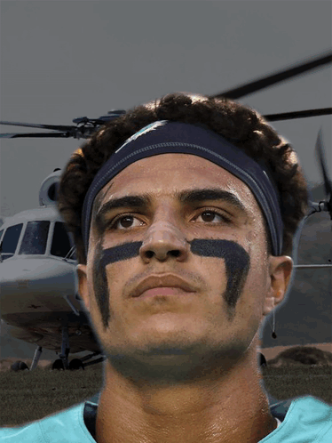 a man wearing a headband with the number 7 on his face