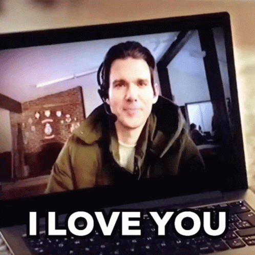 A Man Wearing A Headset Is On A Laptop Screen With The Words I Love You Above Him GIF
