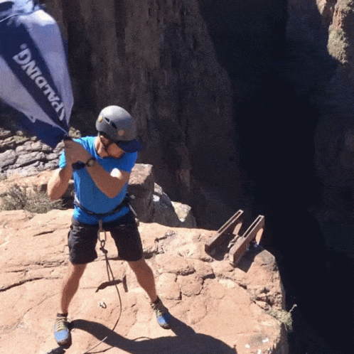 A Man Wearing A Helmet And A Blue Shirt That Says Spalding On It GIF