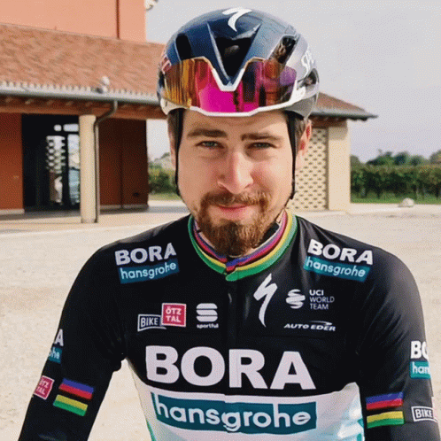 A Man Wearing A Helmet And A Jersey That Says Bora On It GIF