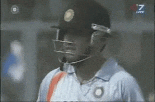 a man wearing a helmet and a shirt with the number 7 on it