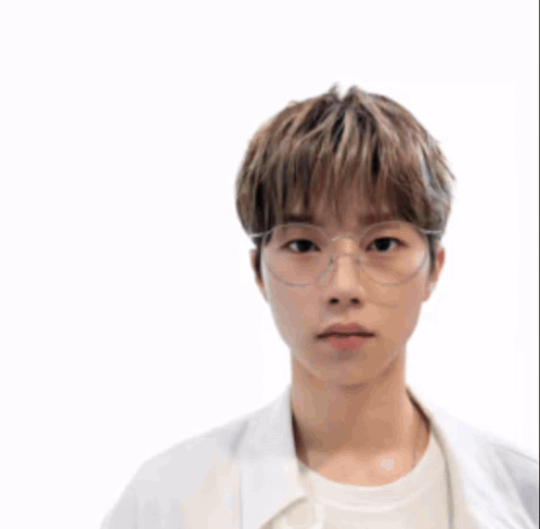A Man Wearing A Helmet And Glasses Stands In Front Of A Battle Scene GIF