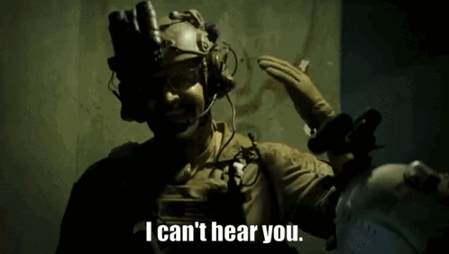 A Man Wearing A Helmet And Gloves Says I Can 'T Hear You GIF
