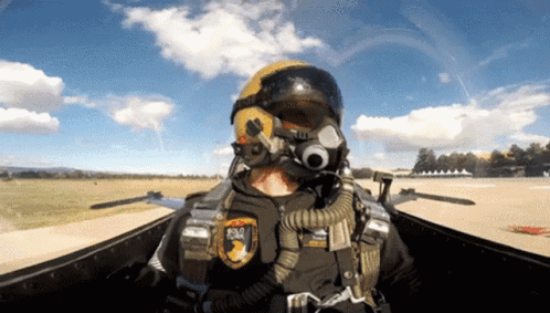 A Man Wearing A Helmet And Goggles Has A Patch On His Chest That Says ' Road ' On It GIF