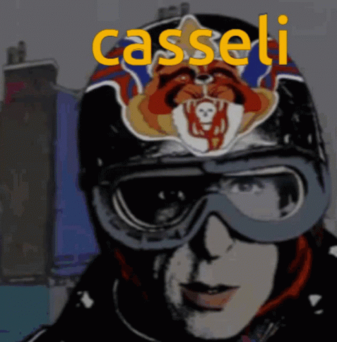 A Man Wearing A Helmet And Goggles With The Name Casseli Written In Yellow GIF