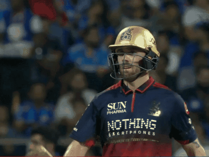 A Man Wearing A Helmet And Holding A Bat That Says Ton On It GIF