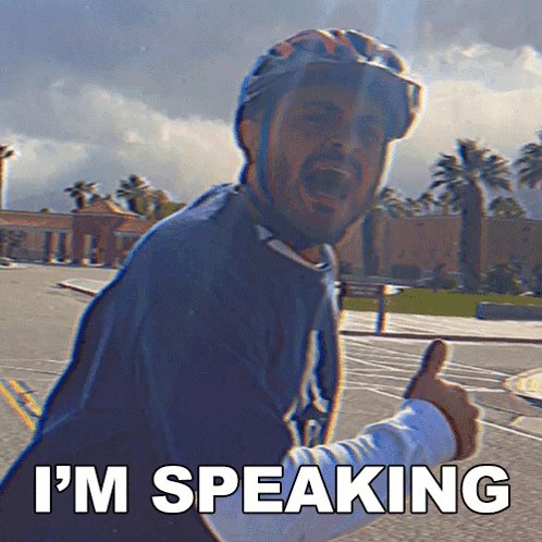 A Man Wearing A Helmet Giving A Thumbs Up With The Words I 'M Speaking Behind Him GIF