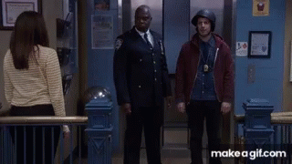 A Man Wearing A Helmet Is Giving A High Five GIF