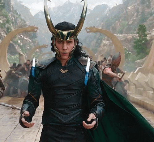 A Man Wearing A Helmet With Horns Is Standing In Front Of A Group Of People GIF