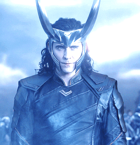 A Man Wearing A Helmet With Horns On His Head Looks At The Camera GIF