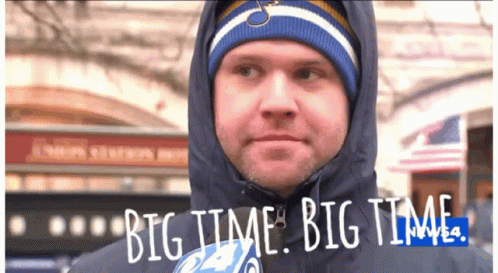 A Man Wearing A Hooded Jacket And A Hat Says Big Time Big Time GIF