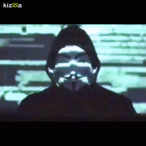 A Man Wearing A Hooded Jacket And A Mask With The Letters Kizola On The Bottom GIF